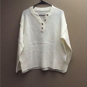 Cream colored sweater, button detail on front